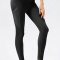 Black leggings worn by a person on a white background